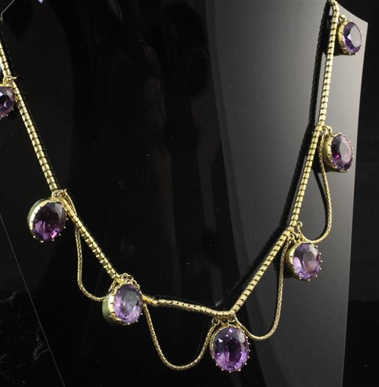 An early 19th century gold and foil backed amethyst fringe necklace, 15.5in.